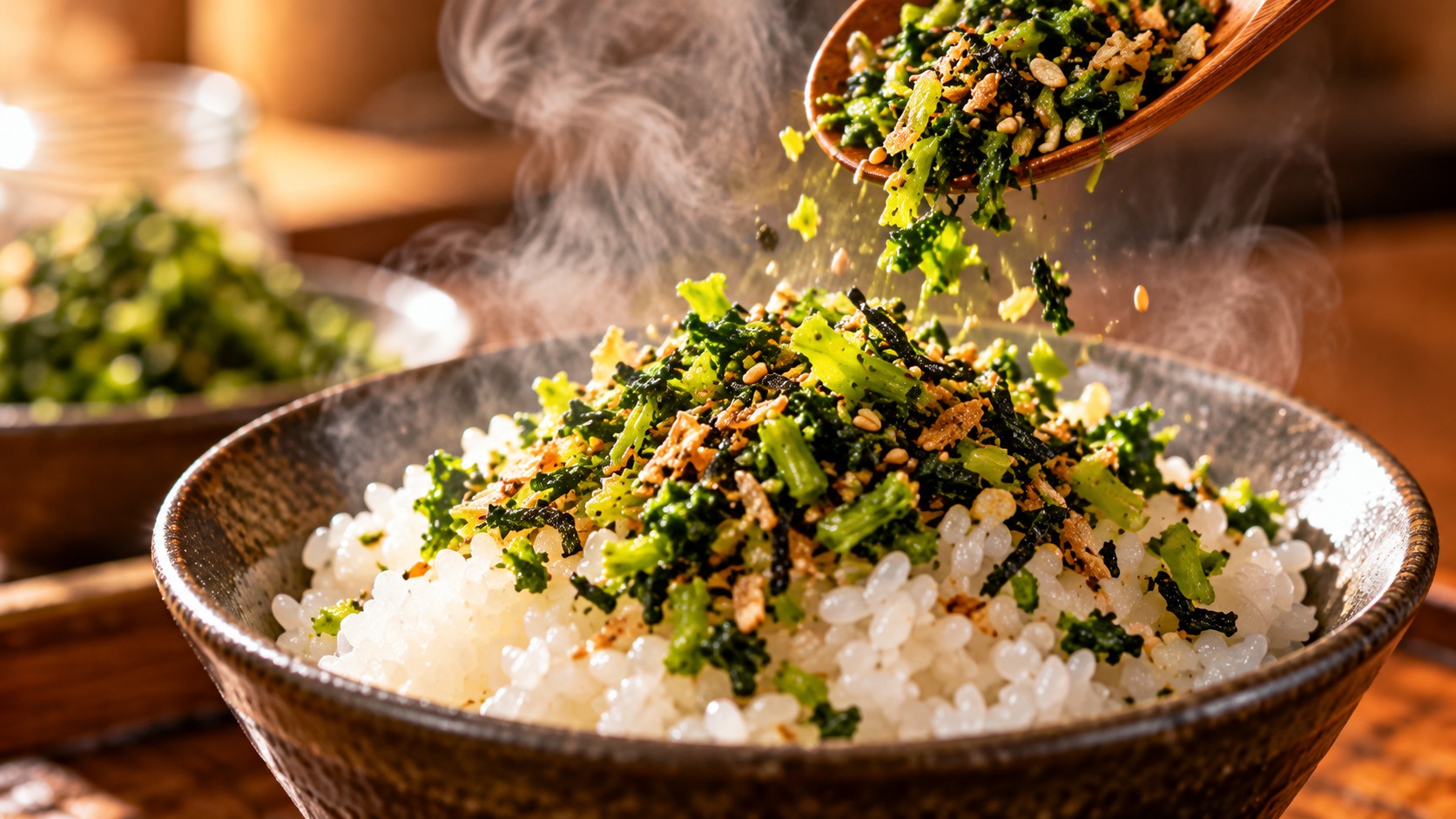 大根の葉のふりかけを炊きたてご飯にかける瞬間 湯気が立つ茶碗